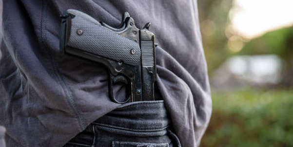 Can Truck Drivers Carry Guns? CDL, DOT and State Laws Explained
